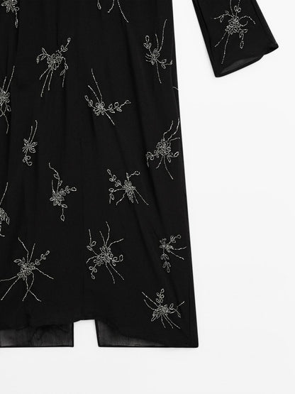 Flowing midi dress with embroidery