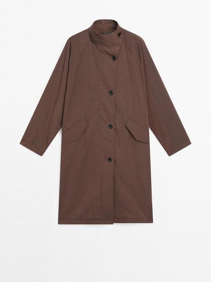 Oversize flowing trench coat in water-repellent fabric