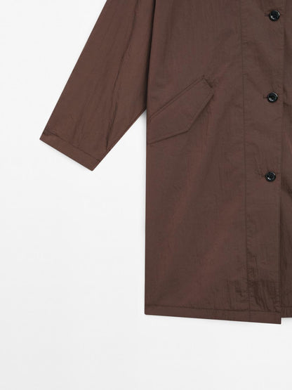 Oversize flowing trench coat in water-repellent fabric