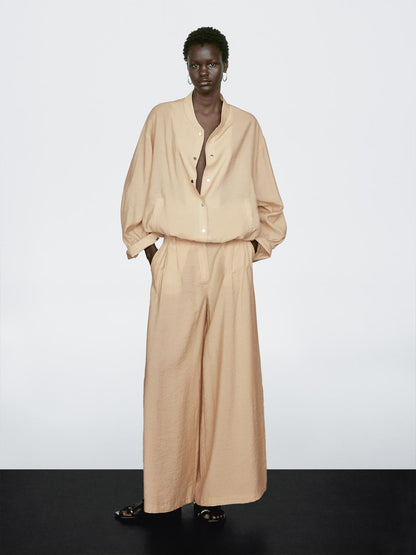 Loose-fitting bomber jacket with drawstring detail