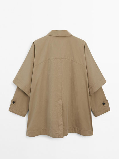 Cape trench coat with long sleeves