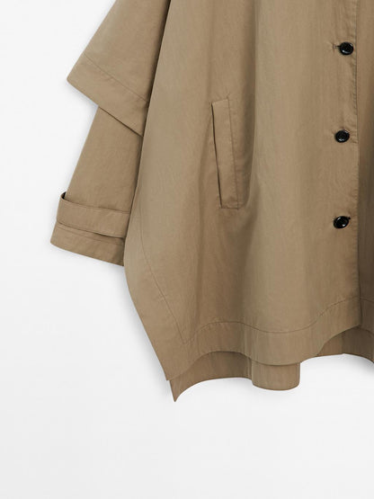 Cape trench coat with long sleeves