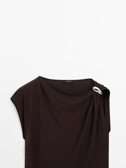 Draped neckline top with brooch detail