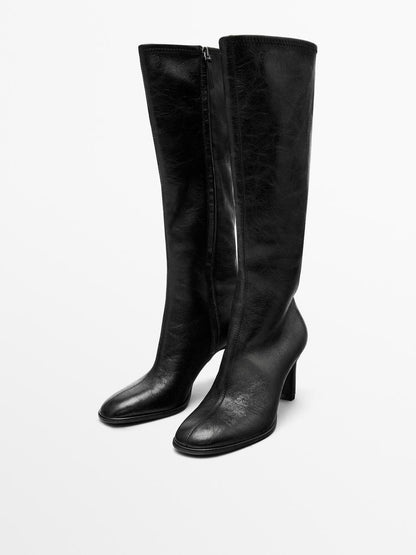 High-heel boots with elastic gores on the leg