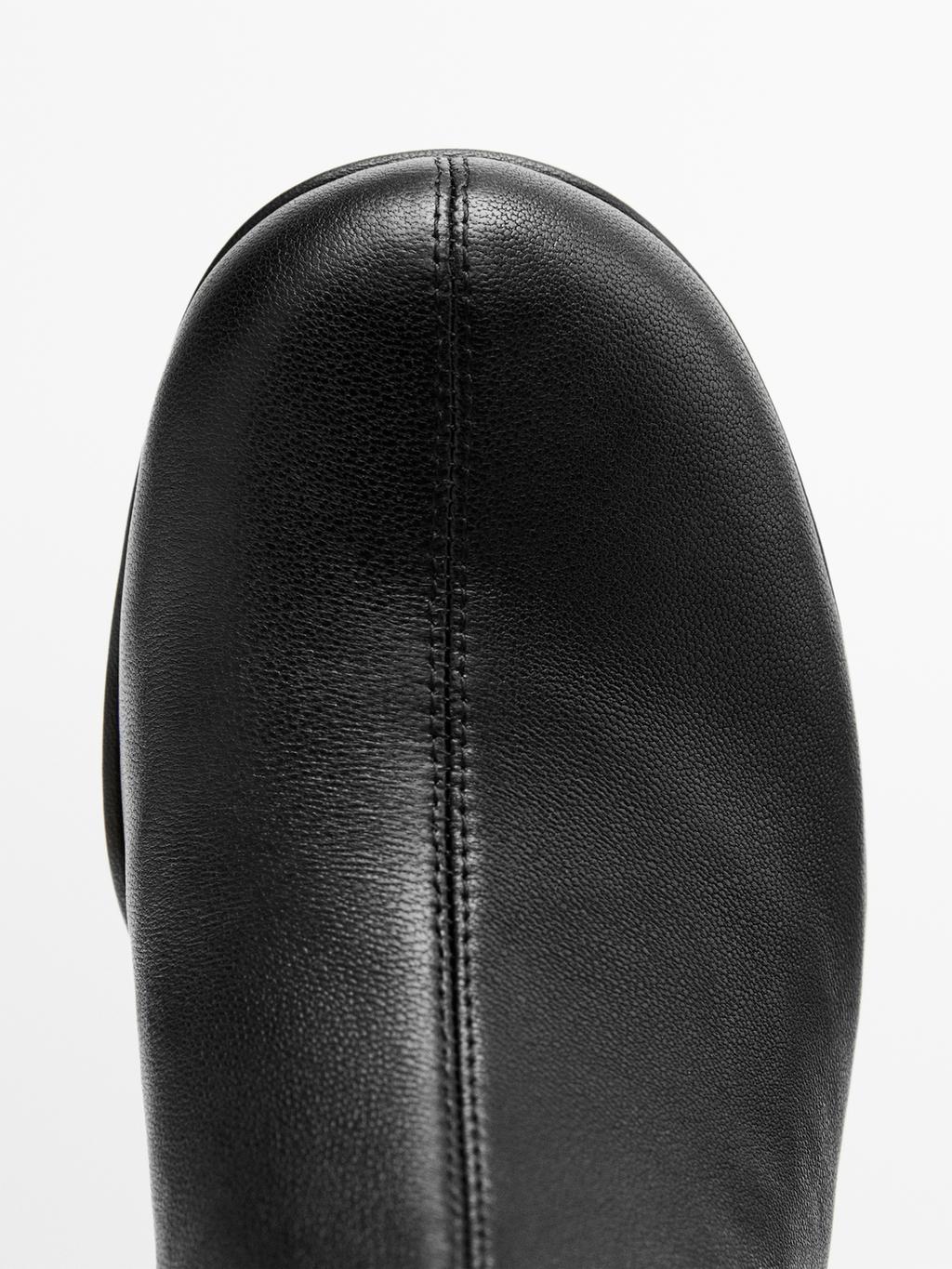 High-heel boots with rounded vamp