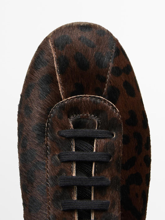 Leopard print hair on leather trainers