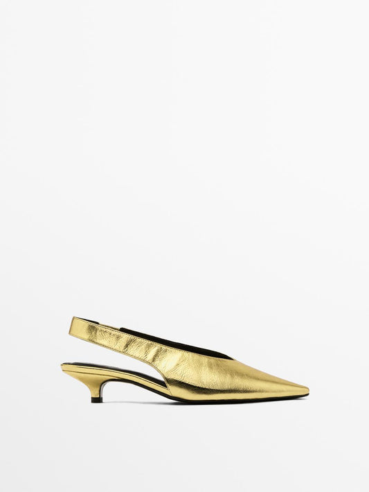 Gold high-heel slingback shoes