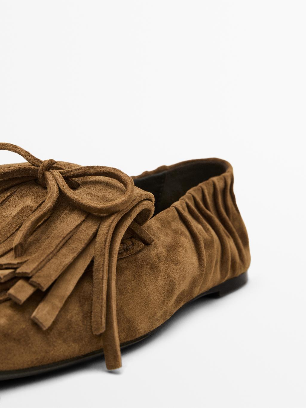 Split suede loafers with fringing