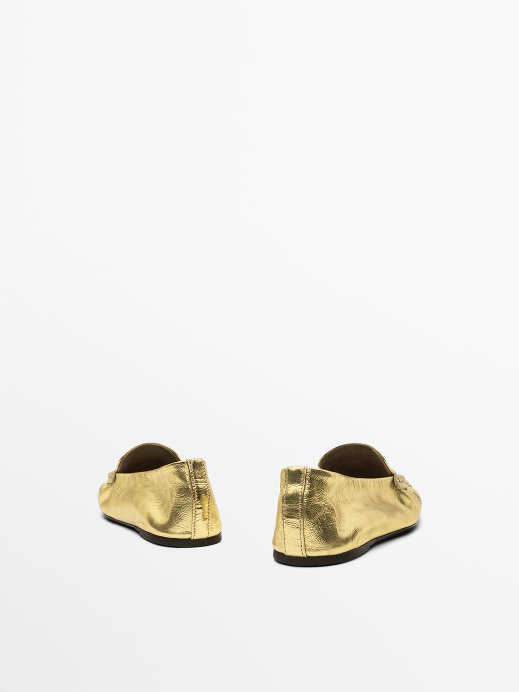 Gold penny loafers